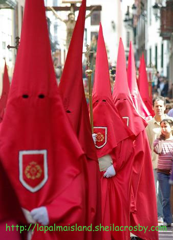 Traditional costumes copied by (not from) the KKK, Holy Week procession, Santa Cruz de la Palma